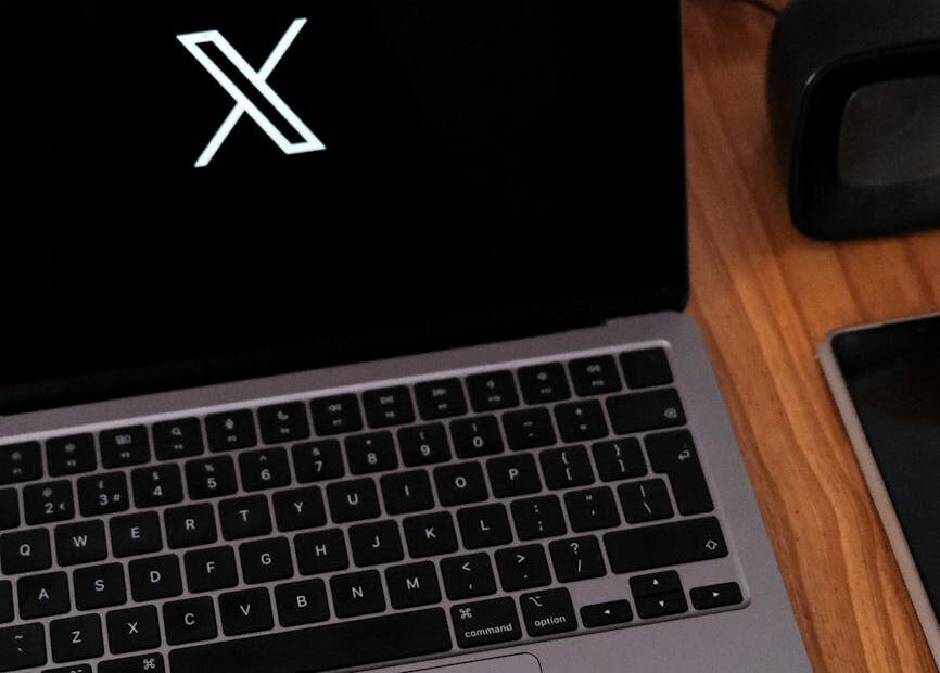 laptop with social media icon on desk