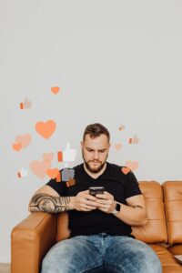 man in black shirt using phone