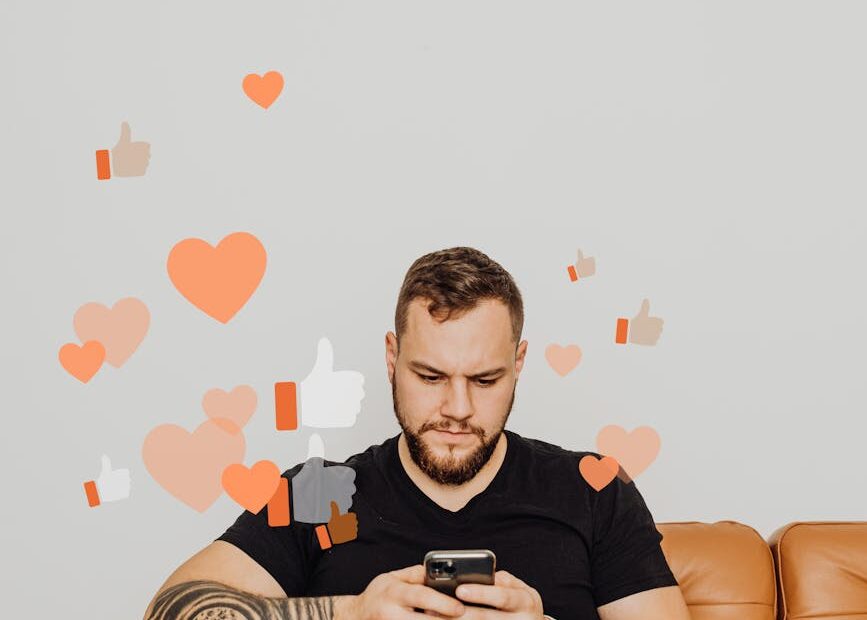 man in black shirt using phone